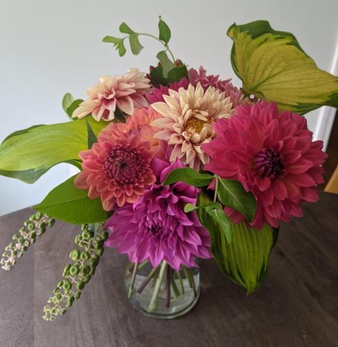 dahlia bouquet with pink, orange, and coral blooms